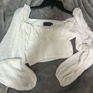 Prettylittlething white cropped top with little designs and corset top.